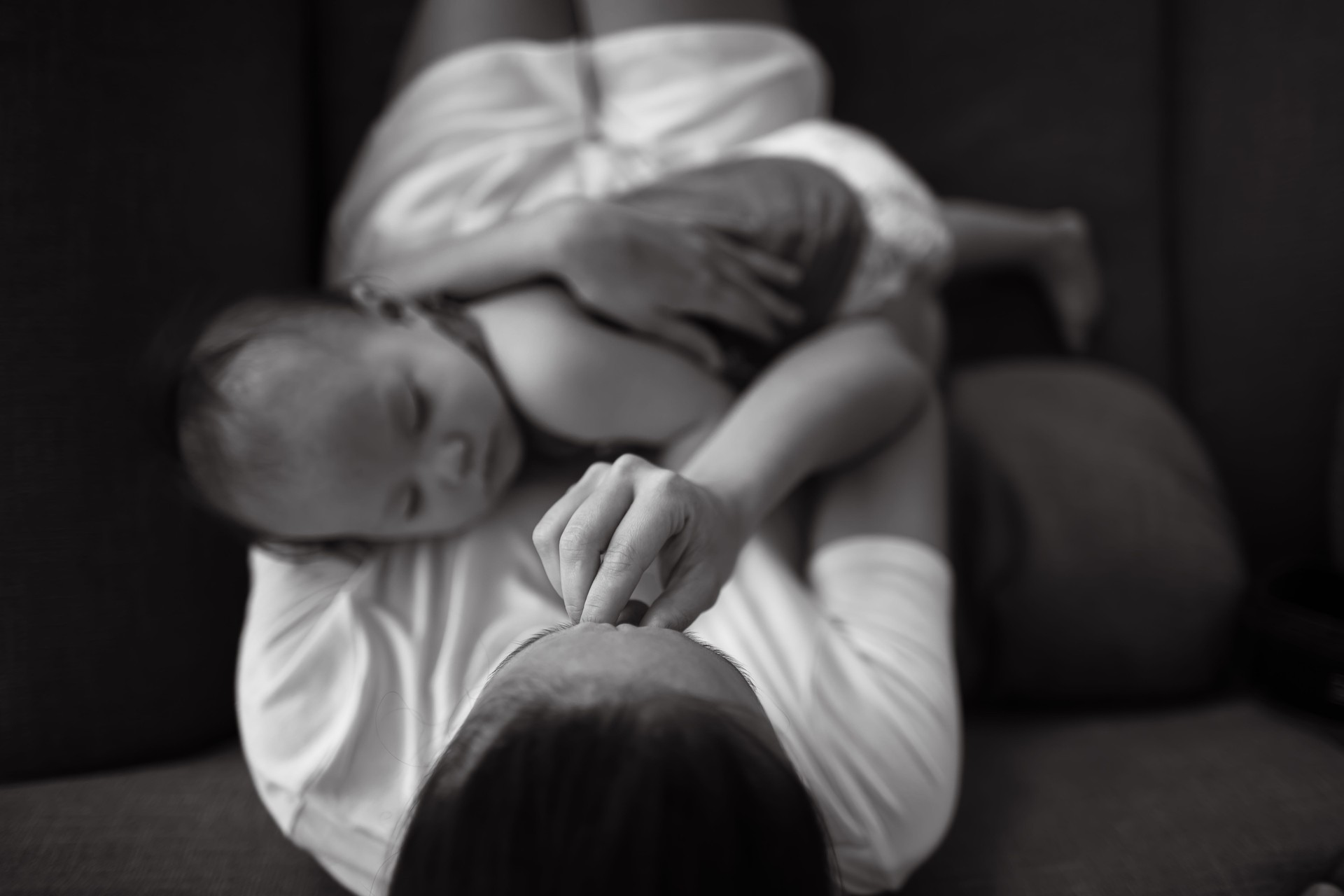 Tired and stressed out mother holding her baby.